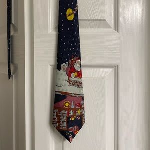 Christmas tie with Santa theme on a dark/navy blue/black background